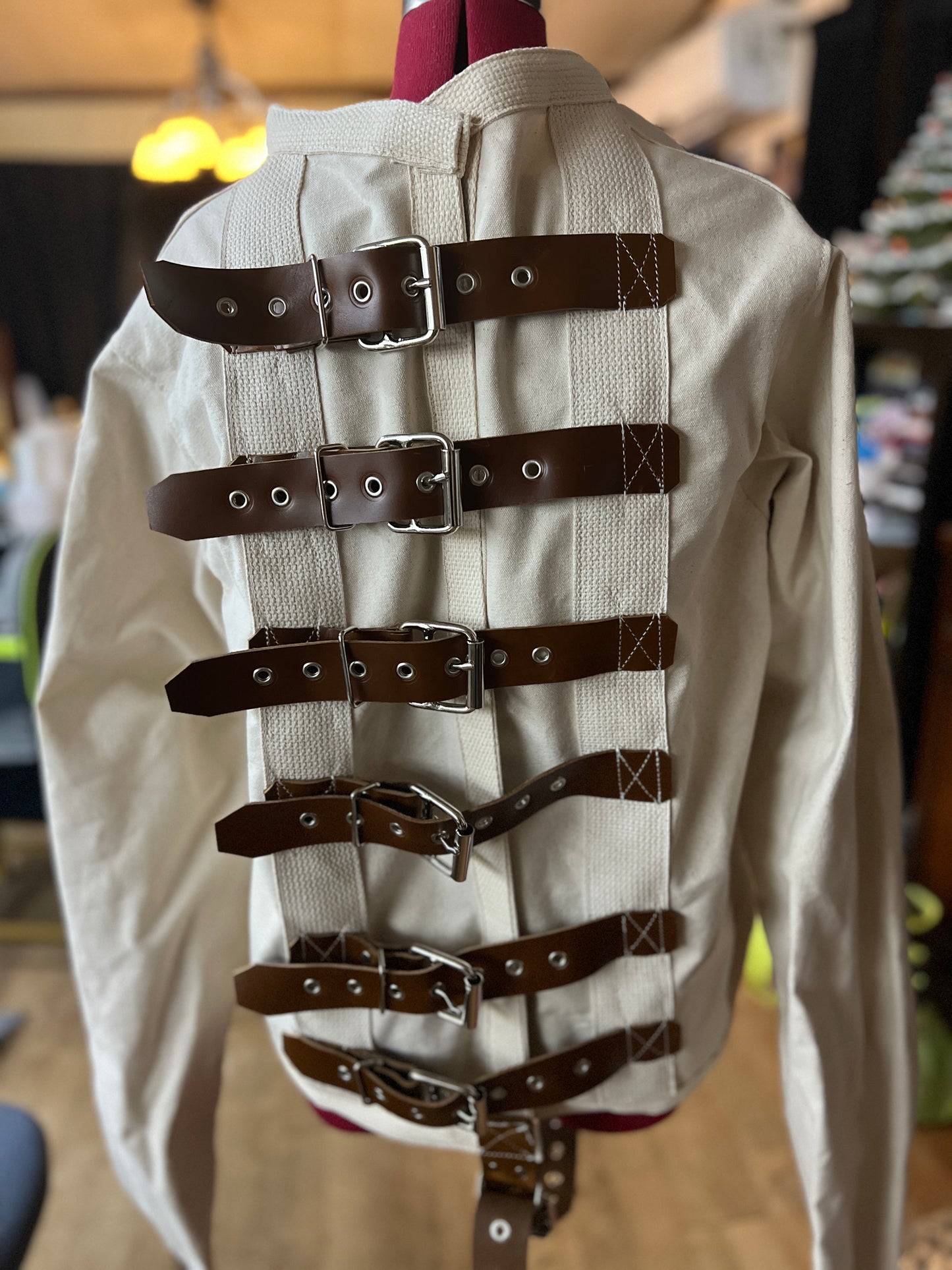 Brown leather strap straitjacket