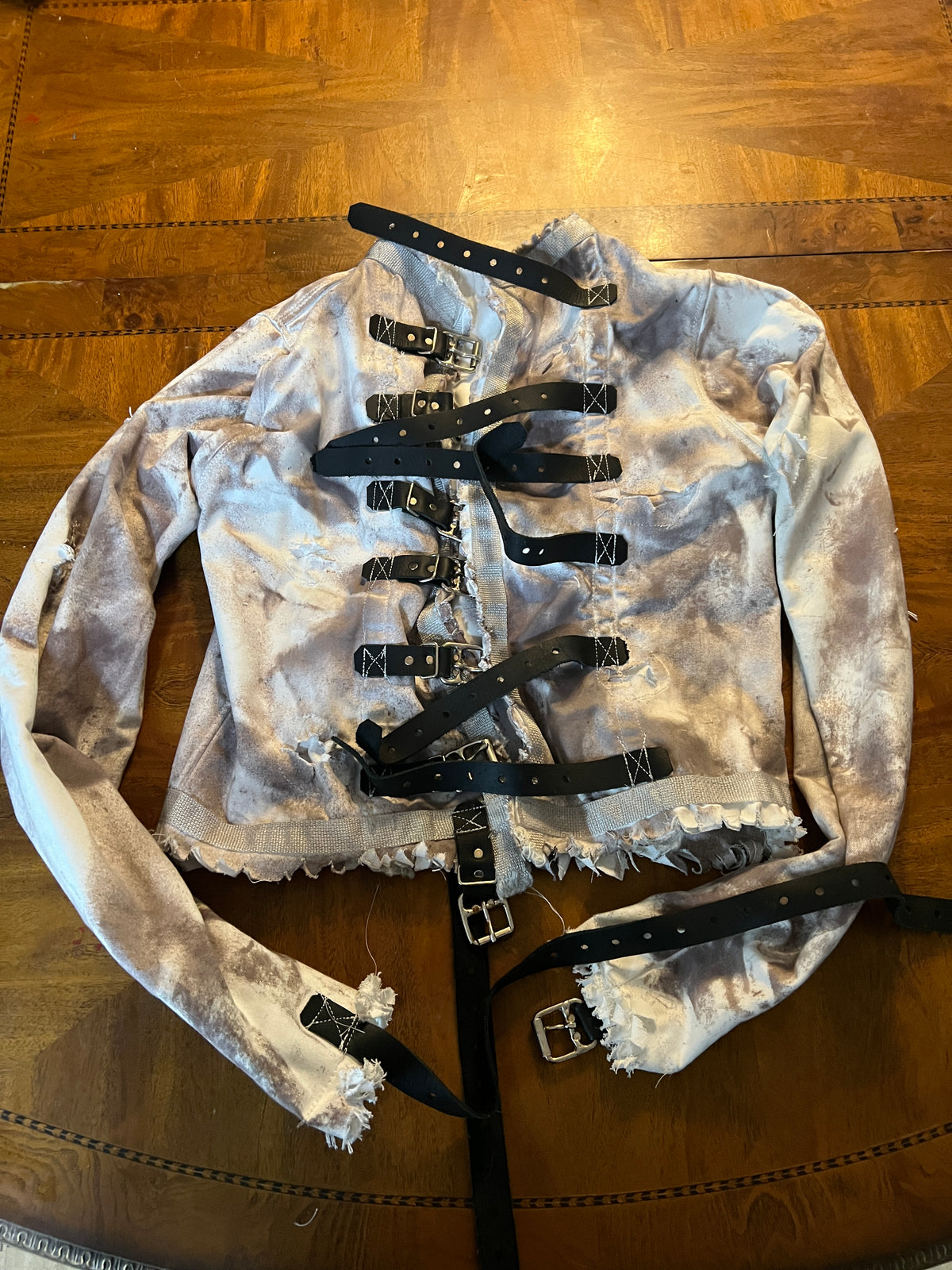 Distressed straight jacket with leather straps