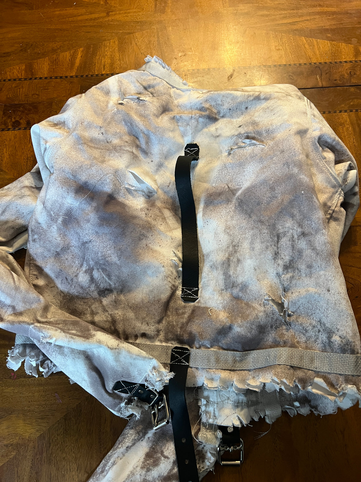 Distressed straight jacket with leather straps